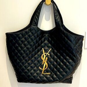 Black quilted tote.
YSL emblem 
Black interior with one side pocket and pouch.